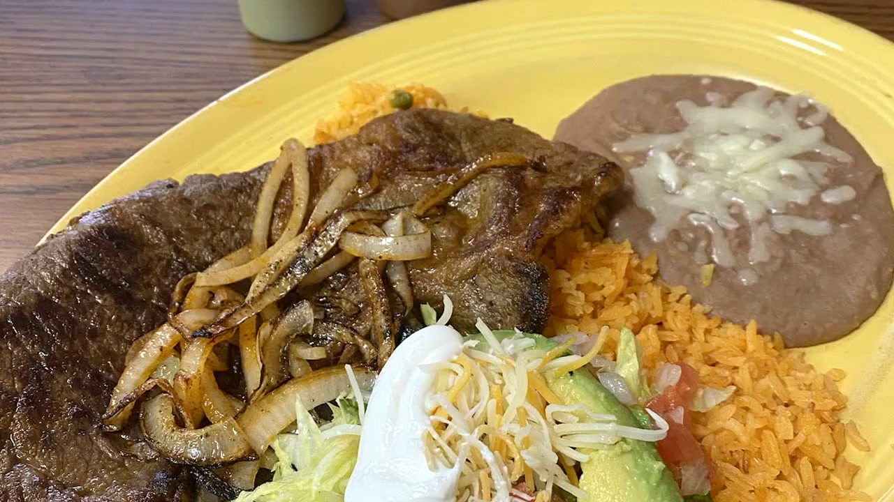 Nela's Tacos carne asada plate with rice, beans and avocado